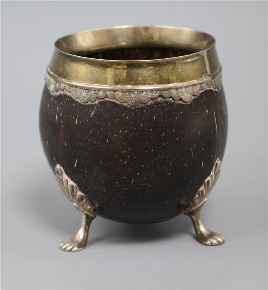 A late 19th/early 20th century white metal mounted coconut cup, 10.3cm.
